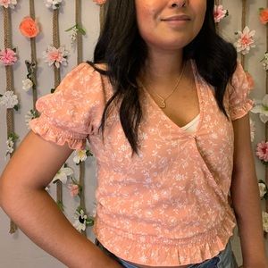 baby pink top with puff sleeves and ruffles